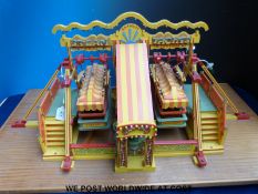 A scratch built set of fairground steam yachts with central engine and organ,