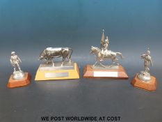 Four military interest pewter statues,