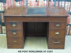 A 19th / early 20thC clerk's desk with lift up writing slope and three drawers to each side (W127
