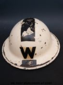 A WWII air raid warden's (ARP) tin helmet