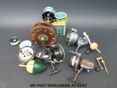 A small collection of vintage fishing tackle including a Penn multiplier reel