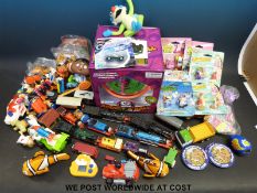 A collection of various toys including Thomas The Tank trains, Addict A Ball,