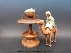 An oak sewing stand together with a leather camel