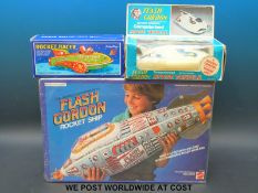 A 1978 Flash Gordon battery operated computerized Space Vehicle together with a Schylling Rocket