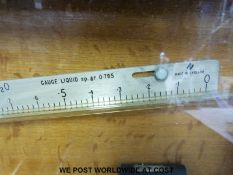 A Negretti & Zambra liquid gauge together with a brass thermometer in a wooden case