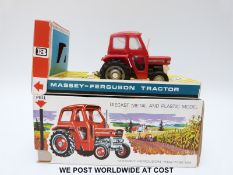 Britains Ltd diecast model Massey-Ferguson 135 Tractor with red and white body and removable safety