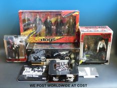 Five Reservoir Dogs and The Godfather figures and games comprising McFerlane Toys Don Vito Corleone,