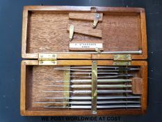 A mahogany cased set of surgical instruments with ivorine label 