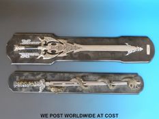 Two Nemesis Now swords on display plinths