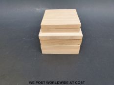 Three wooden Japanese tsuba boxes with silk lined interiors.