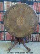 A burr walnut and inlaid topped occasional table (diameter 91,