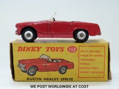 Dinky Toys diecast model Austin Healey Sprite, 112, with red body and cream interior,
