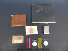 A WWII medal pair comprising 1939-1945 medal and Defence medal in box marked A. J. B.