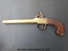A French brass overcoat pistol named J&W Richard to one side and A.