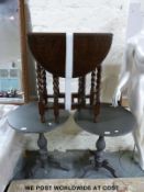 Two grey painted tripod tables (diameter 60cm)