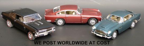 Three Franklin Mint diecast model vehicles, 1964 Aston Martin DB5,
