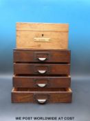 A pine stationery box with fitted interior and and a miniature oak chest of four drawers.