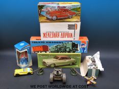 A collection of tinplate toys to include Minister Deluxe Car, miniature tinplate railway,