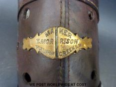 A 19thC leather horse nose bag or muzzle with brass plaque 'Maker T.