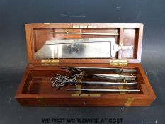 A cased field surgeon's surgical / amputation set in mahogany box circa early 20thC by J Richardson