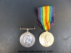 A WWI medal pair awarded to 186040 GNR E. Rose R.
