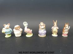 Six Beswick Beatrix Potter figures including Mrs Tiggy-Winkle, The Tailor of Gloucester,