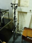 A floral metal standard lamp in the manner of Benson,