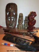 A quantity of African masks, whip etc.