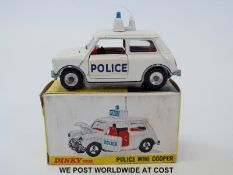 Dinky Toys diecast model Police Mini Cooper, 250, with white body, roof sign, aerial,