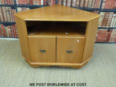 A contemporary light oak or similar corner unit