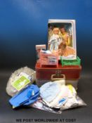 A collection of small dolls including Palitoy and Delmare and two small suitcases containing dolls'
