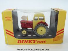 Dinky Toys diecast model David Brown Tractor 305, with yellow cab, exhaust and hubs,
