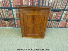 A yew wood hanging corner cupboard (H83cm) and similar side table