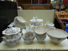 A 19thC ornate tea set decorated with relief moulded lilac flowers in the Rockingham style