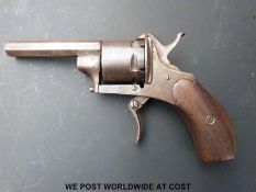 Six shot hammer action pin fire revolver with wooden grips, folding trigger and 2.