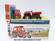 Britains Ltd diecast model Massey-Ferguson 135 Tractor with red and white body and removable safety