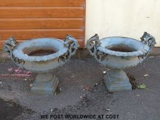 A pair of cast iron garden urns or planters (width 81cm,