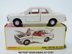 Dinky Toys diecast model Ford Cortina De Luxe, 159, with cream body, red interior and spun hubs,