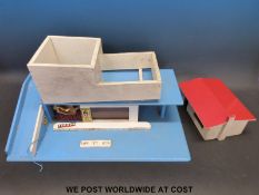 Tri-ang wooden car garage in original box together with another similar garage