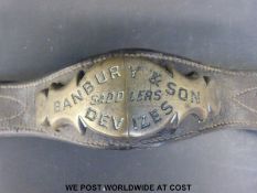 A quantity of horse harnesses with brass mounts,