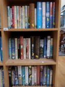 Approximately 45 military related first edition novels and titles on military subjects,