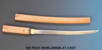 A Japanese Edo period Wakazashi sword with gold inlaid Habiki in a Shirasaya