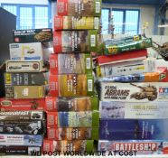 Twenty-five Airfix, Tamiya, Plastic Soldier and other model kits, together with two jigsaw puzzles,