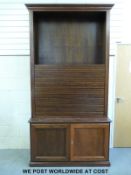 A large oak filing/TV cabinet with tambour style top section (W130 D44 H251cm)