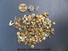 A collection of military buttons, mostly King's crown, an 18th Royal Hussars badge,