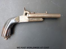 Double barrelled side by side pinfire hammer action pistol with carved grip, engraved locks,