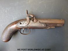 A percussion hammer action pistol with chequered grip indistinctly named and engraved lock and