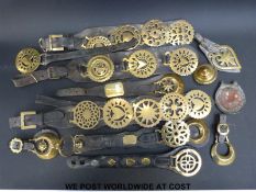 A quantity of martingales and other horse harnesses with brasses to include snowflake, heart,