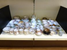 A large collection of demitasse, coffee and tea cups and saucers, including Royal Worcester Regency,