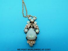 A 9ct gold necklace set with opals and diamonds in a foliate design